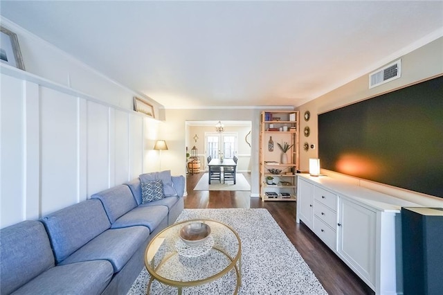 living room with dark hardwood / wood-style flooring