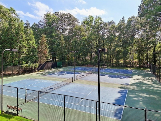 view of tennis court featuring basketball court