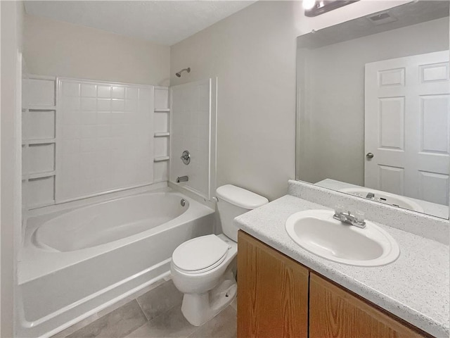full bathroom featuring toilet, vanity, tile patterned flooring, and washtub / shower combination