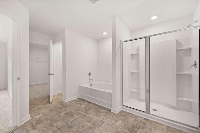 bathroom with separate shower and tub