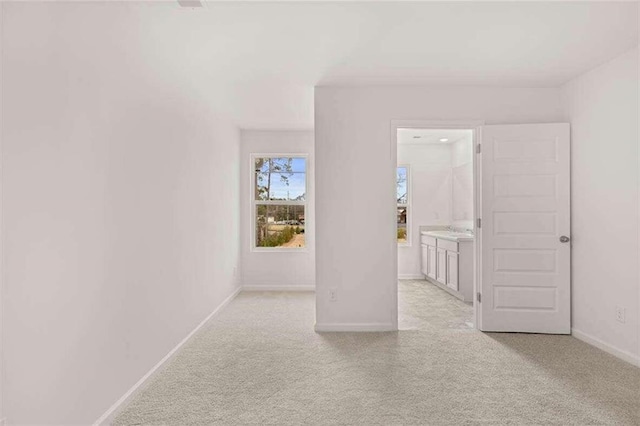 interior space featuring light colored carpet