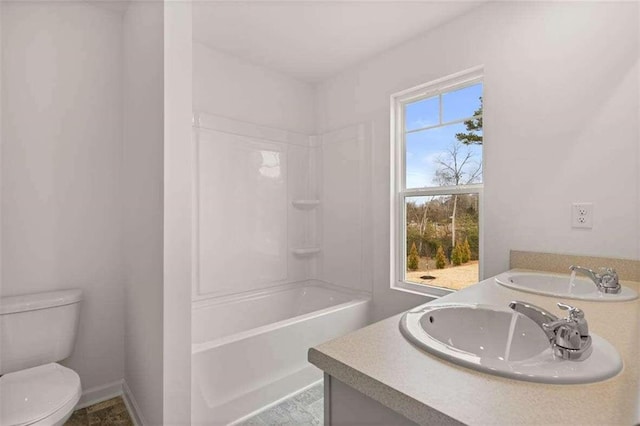 full bathroom featuring vanity, toilet, and shower / bathtub combination