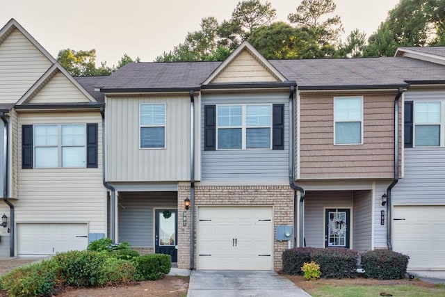 multi unit property featuring a garage