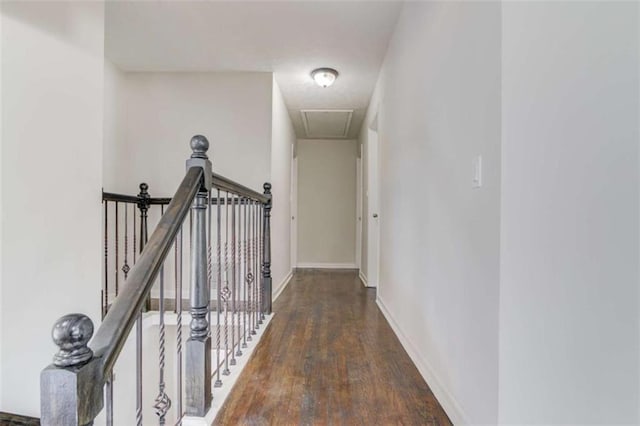 hallway with dark hardwood / wood-style flooring