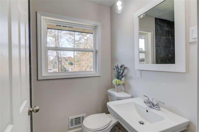 bathroom with toilet and sink