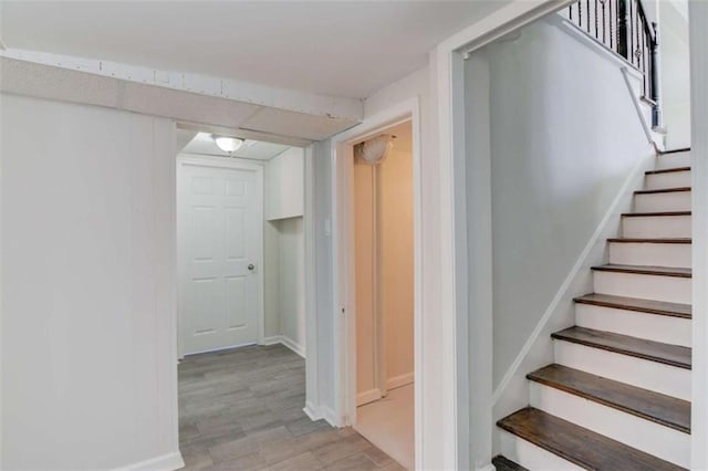 staircase featuring hardwood / wood-style floors