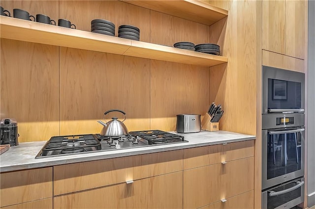 kitchen featuring light brown cabinets and stainless steel appliances