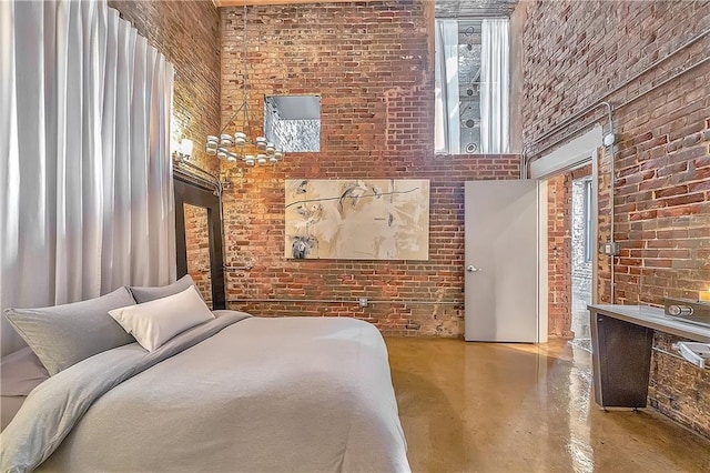 bedroom featuring brick wall