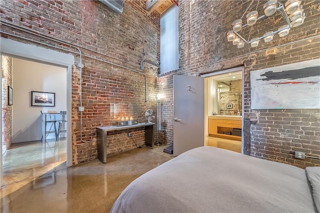 bedroom with brick wall and a high ceiling