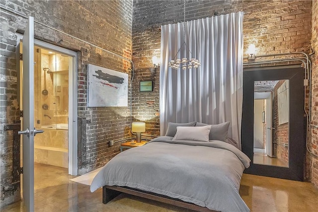 bedroom with brick wall and ensuite bathroom