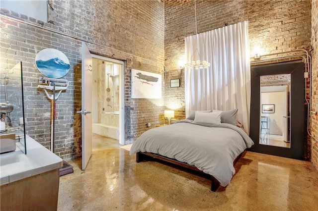 bedroom featuring brick wall and a high ceiling