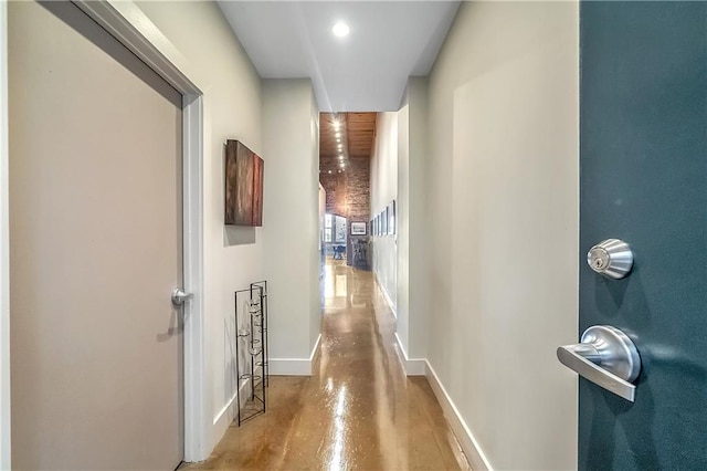 hallway with concrete flooring