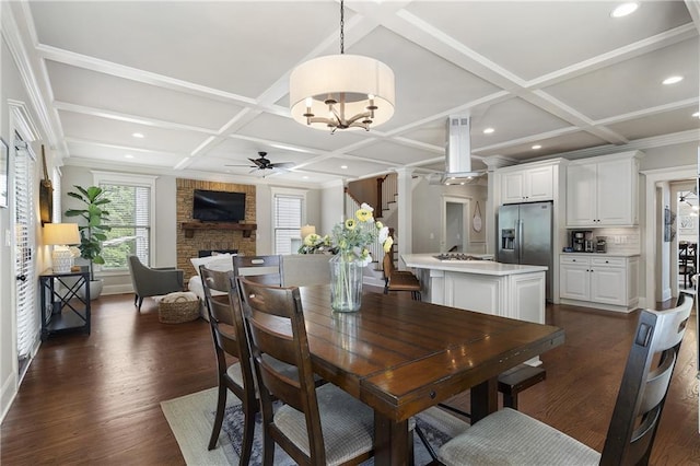 dining space with recessed lighting, ceiling fan with notable chandelier, coffered ceiling, and dark wood-style flooring