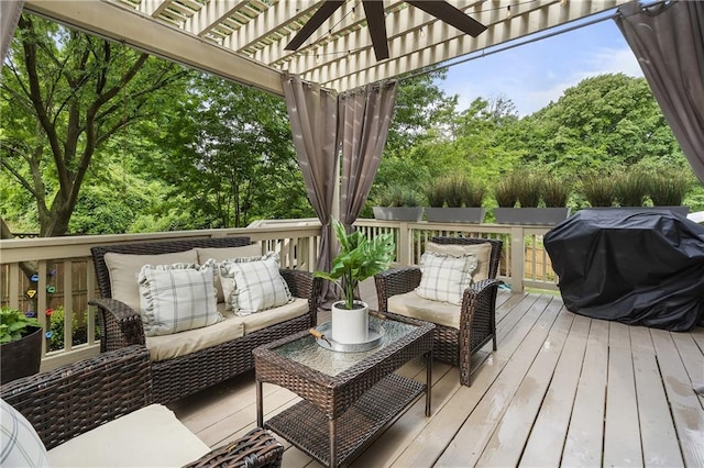 deck with a pergola, an outdoor hangout area, and grilling area