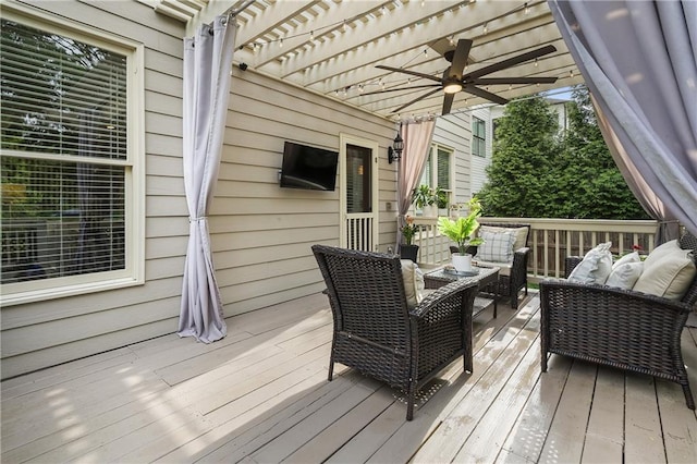 deck featuring an outdoor living space, ceiling fan, and a pergola