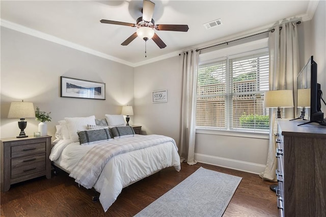 bedroom featuring ceiling fan, dark wood-style flooring, baseboards, visible vents, and crown molding