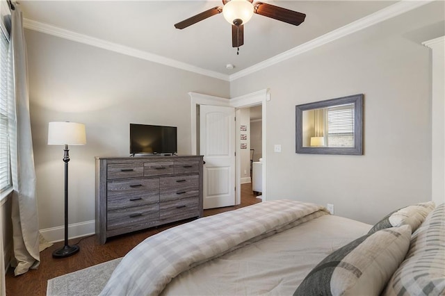 bedroom with baseboards, ornamental molding, a ceiling fan, and wood finished floors