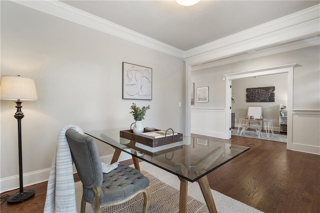 home office with wood finished floors, ornamental molding, and baseboards