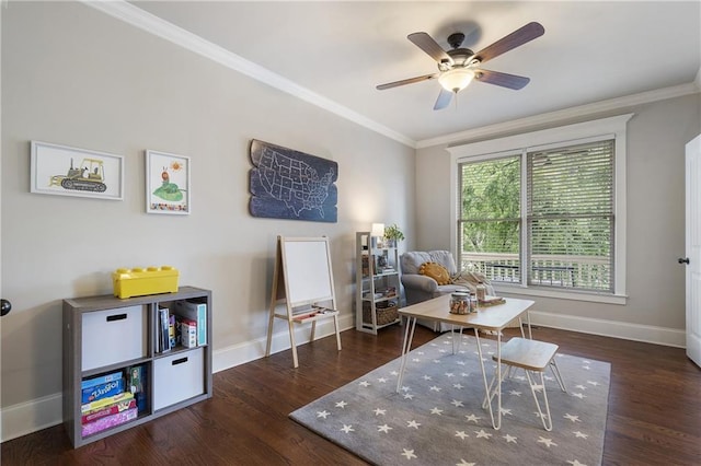 living area with wood finished floors, ornamental molding, and baseboards