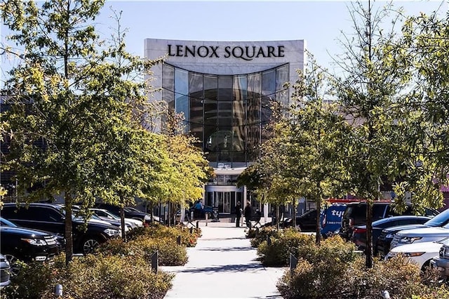 view of property featuring uncovered parking