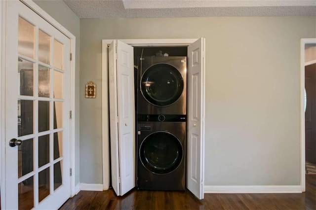 1137 Eagles Nest Cir, Carrollton, GA 30116 - laundry room featuring stacked washer and clothes dryer and dark wood-style floors