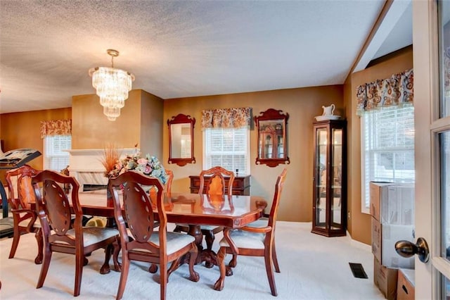 1137 Eagles Nest Cir, Carrollton, GA 30116 - dining room with a chandelier, healthy amount of natural light, and light colored carpet
