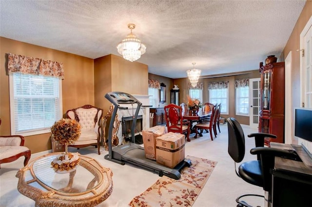 1137 Eagles Nest Cir, Carrollton, GA 30116 - carpeted living room featuring a chandelier and a textured ceiling