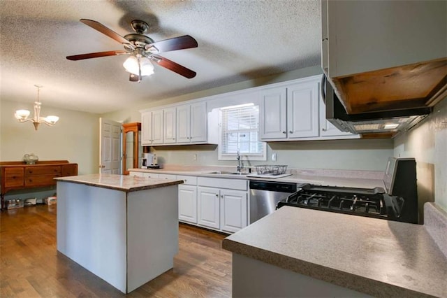 1137 Eagles Nest Cir, Carrollton, GA 30116 - kitchen with dishwasher, extractor fan, a textured ceiling, white cabinets, and a center island