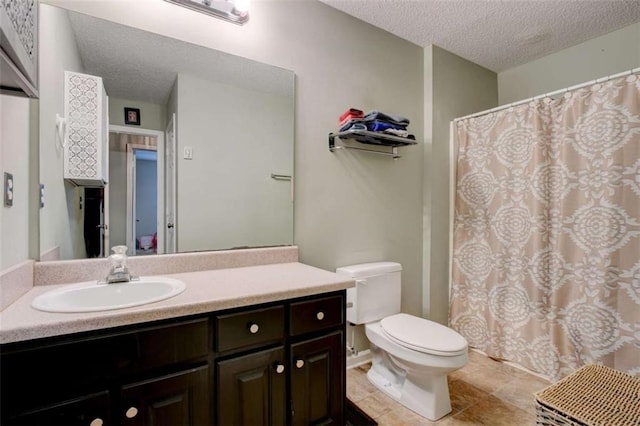 1137 Eagles Nest Cir, Carrollton, GA 30116 - bathroom featuring a textured ceiling, vanity, a shower with shower curtain, and tile patterned flooring