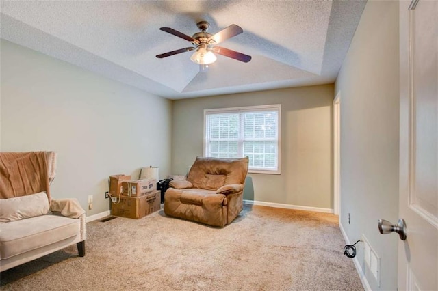 1137 Eagles Nest Cir, Carrollton, GA 30116 - sitting room featuring carpet floors, ceiling fan, a raised ceiling, and a textured ceiling
