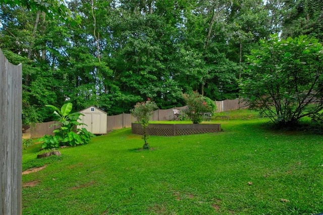 1137 Eagles Nest Cir, Carrollton, GA 30116 - fenced backyard featuring a storage shed