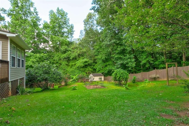 1137 Eagles Nest Cir, Carrollton, GA 30116 - fenced backyard featuring a shed
