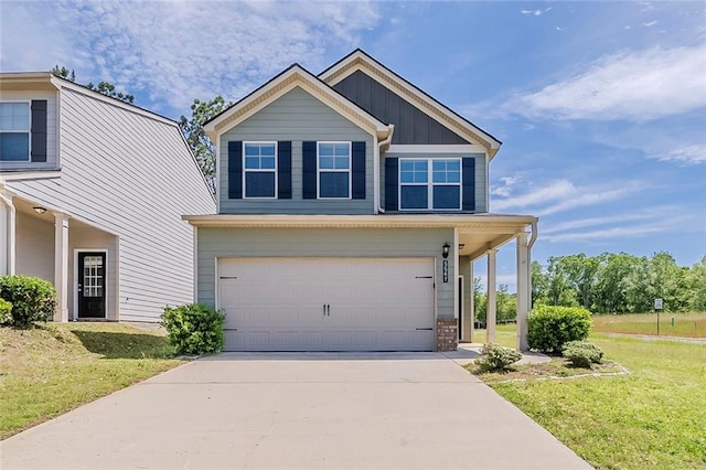 view of front of property featuring board and batten siding, a garage, a front lawn, and driveway