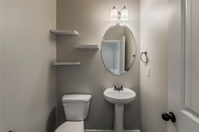 bathroom featuring toilet
