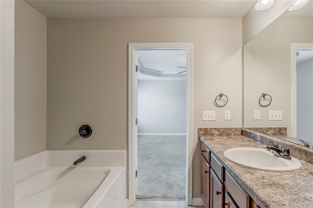 full bathroom with a garden tub and vanity