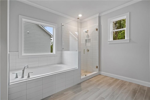 bathroom with crown molding and independent shower and bath