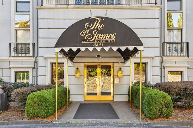 view of exterior entry featuring french doors