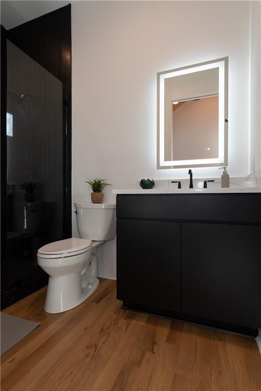 269 Clarice Ln, Sautee Nacoochee, GA 30571 - bathroom with wood finished floors, vanity, a walk in shower, and toilet
