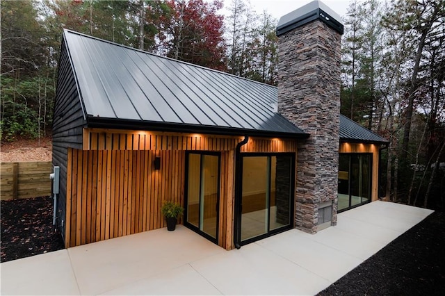 269 Clarice Ln, Sautee Nacoochee, GA 30571 - rear view of house with a chimney, a standing seam roof, a patio, and metal roof