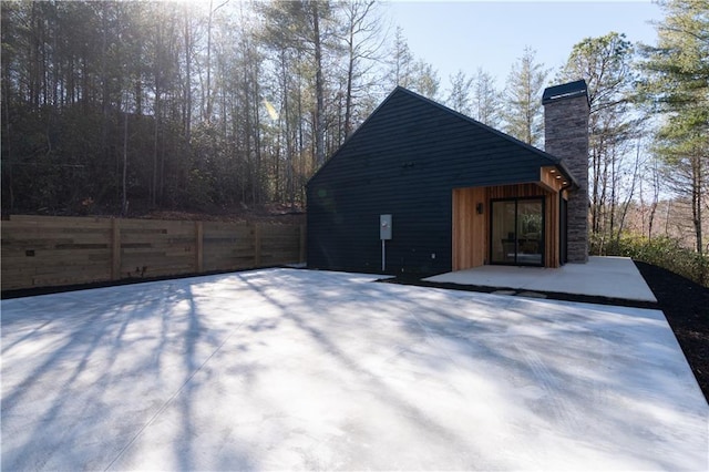 269 Clarice Ln, Sautee Nacoochee, GA 30571 - view of property exterior with a chimney and fence