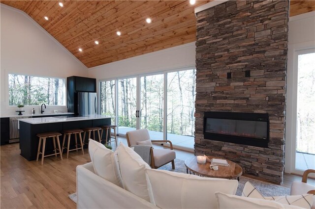 269 Clarice Ln, Sautee Nacoochee, GA 30571 - living room featuring high vaulted ceiling, light wood-style flooring, a healthy amount of sunlight, and wooden ceiling