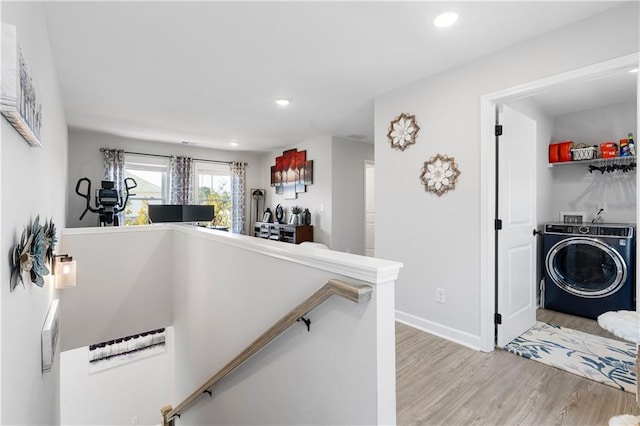 interior space with washer / clothes dryer and light hardwood / wood-style flooring