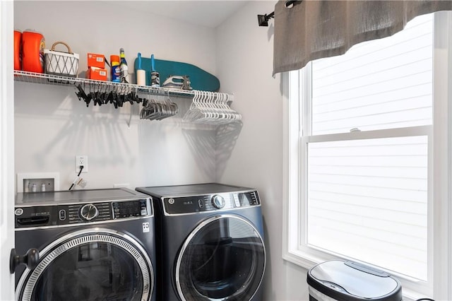 washroom featuring washing machine and clothes dryer