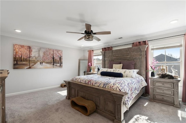 bedroom with crown molding, ceiling fan, and carpet flooring