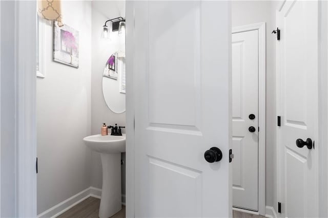 bathroom with hardwood / wood-style flooring