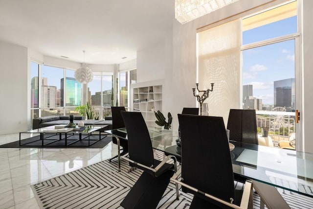 285 Centennial Olympic Park Dr NW Unit Ph2-7, Atlanta, GA 30313 - dining room featuring a skyline view and a chandelier