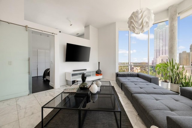 285 Centennial Olympic Park Dr NW Unit Ph2-7, Atlanta, GA 30313 - living room with a chandelier, healthy amount of natural light, baseboards, and a barn door