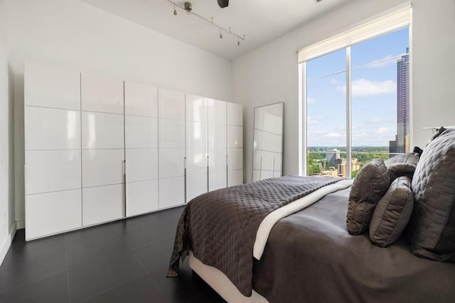 285 Centennial Olympic Park Dr NW Unit Ph2-7, Atlanta, GA 30313 - bedroom with track lighting and multiple windows