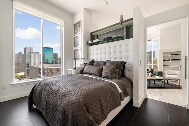285 Centennial Olympic Park Dr NW Unit Ph2-7, Atlanta, GA 30313 - bedroom with baseboards and a view of skyline