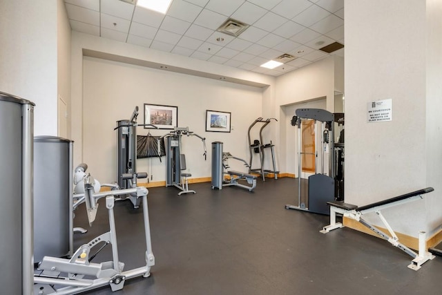 285 Centennial Olympic Park Dr NW Unit Ph2-7, Atlanta, GA 30313 - exercise room featuring a paneled ceiling and baseboards